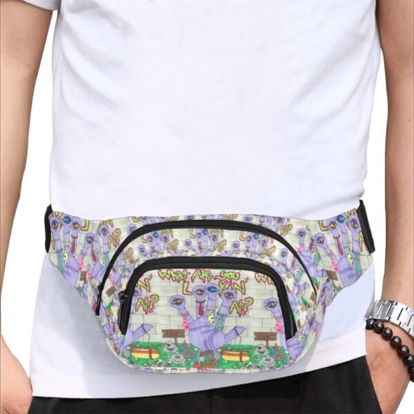 Colorful fanny pack featuring a quirky, playful design with multiple purple alien-like creatures, each with three eyes and wearing ties, standing in front of a brick wall. Graffiti-style text reads 'What are you lookin' at?' above them, adding a bold, street-art vibe. The pack includes two zippered compartments and an adjustable strap, blending artistic expression with everyday functionality. An original Imaginables creation that stands out with its unique character-driven artwork